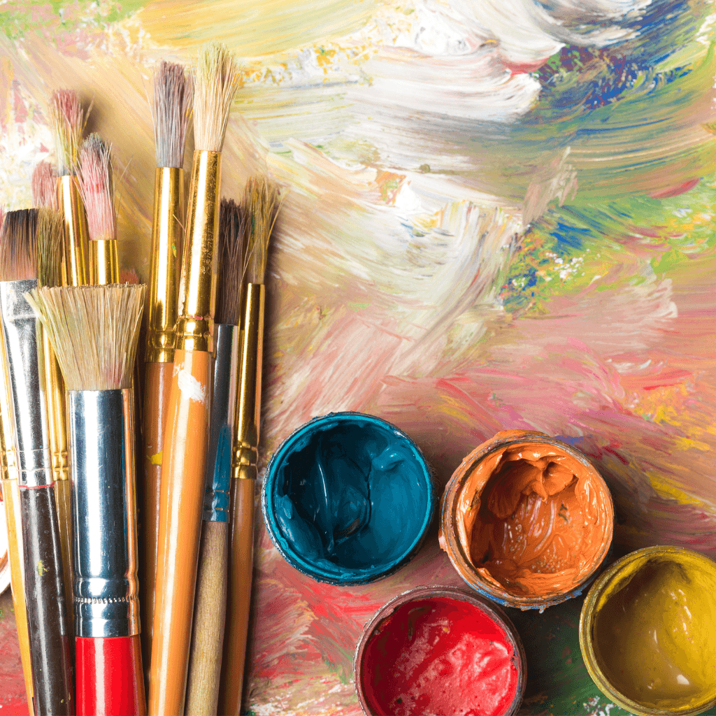 Oil paints and brushes in an artist's studio