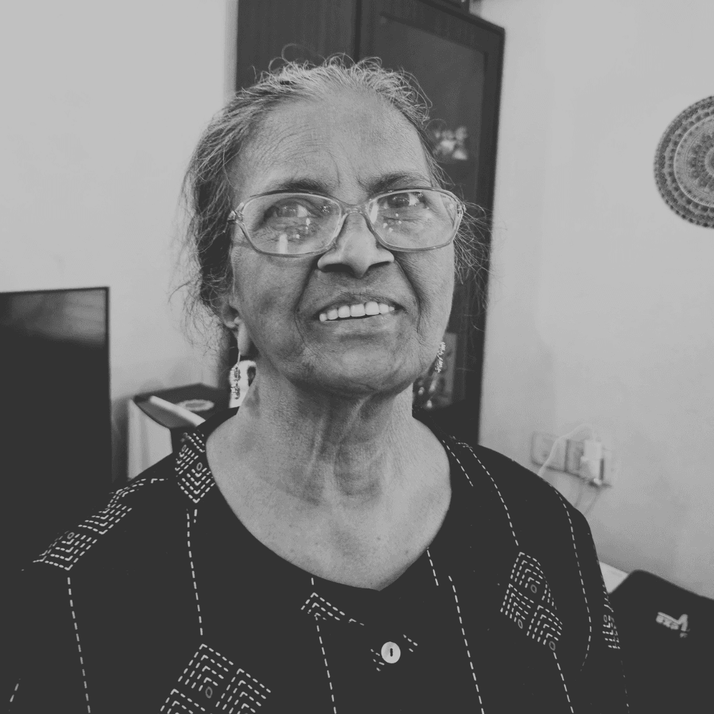 Renatha Fernandes focused on an oil painting